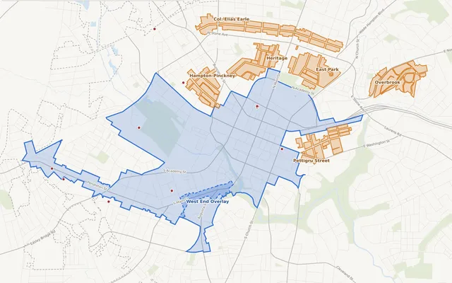 Map of Greenville, SC design review areas: the Downtown Design District and West End Overlay in blue, six historic preservation districts in orange, and local landmarks as red dots